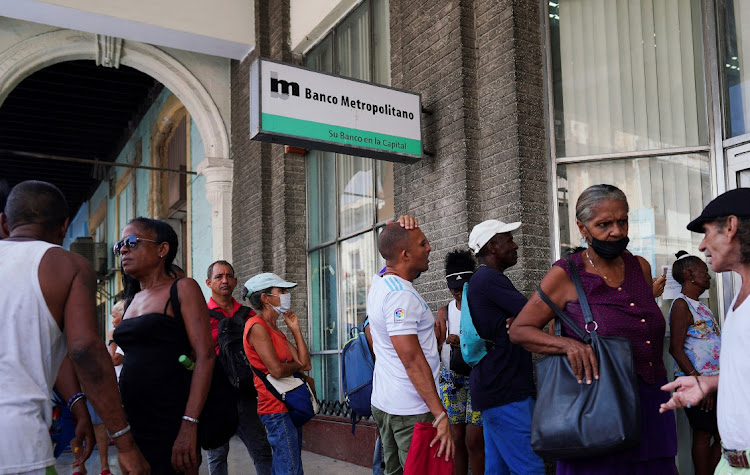 People wait in line to enter a bank in Havana, Cuba, August 18 2023. Picture: ALEXANDRE MENEGHINI/REUTERS