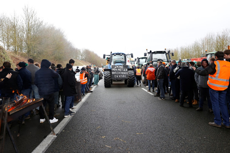 French farmers block the A16 highway with their tractors to protest over price pressures, taxes and green regulation, grievances. Picture: ABDUL SABOOR