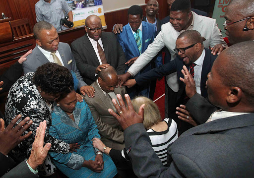 STRENGTH IN PRAYER: Newly appointed BCM mayor Alfred Mtsi and his wife, Nolundi, receive prayers from various church leaders from around the metro at a special prayer service at Faith Alive Bible Church yesterday Picture: SIBONGILE NGALWA
