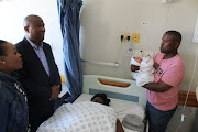 Eastern Cape premier Lubabalo Oscar Mabuyane and his wife Siyasanga, left, congratulate parents Ncamile, right, and Xoliswa Dyala on the birth of their daughter on New Year’s Day.  
