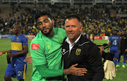Goalkeepoer Shu-Aib Walters (L) and Eric Tinkler of Cape Town City celebrates during the Absa Premiership match between Cape Town City FC and Mamelodi Sundowns at Athlone Stadium on March 03, 2017 in Cape Town, South Africa.