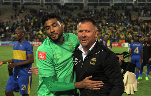 Goalkeepoer Shu-Aib Walters (L) and Eric Tinkler of Cape Town City celebrates during the Absa Premiership match between Cape Town City FC and Mamelodi Sundowns at Athlone Stadium on March 03, 2017 in Cape Town, South Africa.