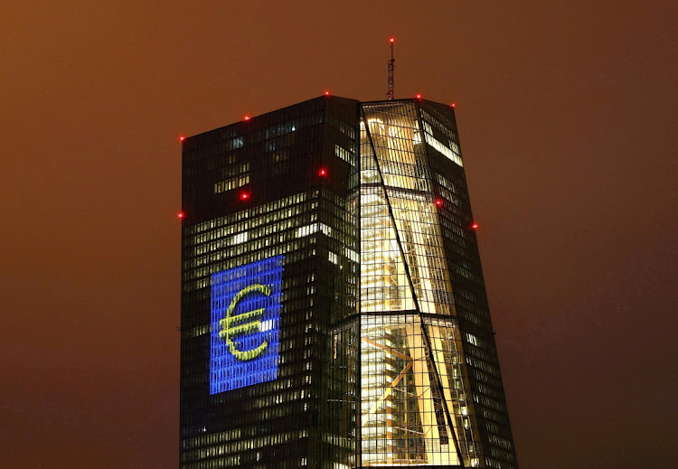 The headquarters of the European Central Bank is illuminated with a giant euro sign in Frankfurt on March 12 2016. File Picture: REUTERS/Kai Pfaffenbach//