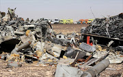 The remains of a Russian airliner are seen as rescue crews wait at the crash site in al-Hasanah area in El Arish city, north Egypt. Picture Credit: Reuters