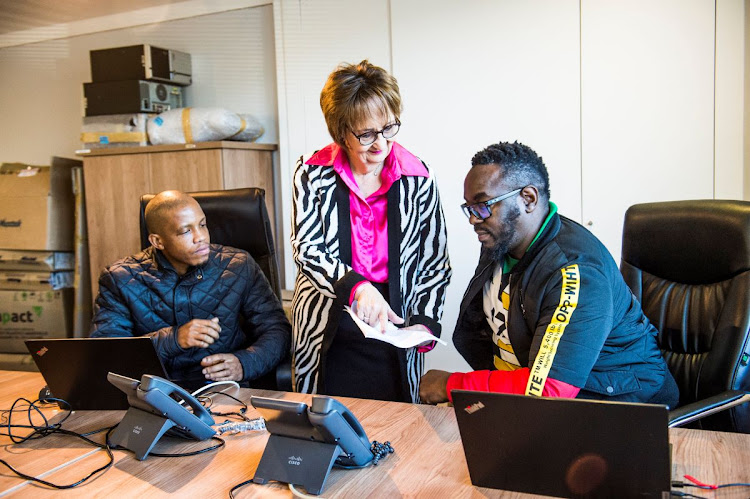 Wolmarans and her colleagues created the EVDS in record time during Covid. Here she’s meeting with Desmond Masalesa en Batandwa Sukwama. Picture: Delwyn Versamy