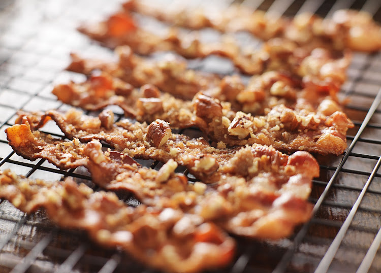 Candied bacon with pecan nuts.