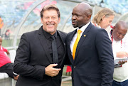 Luc Eymael with Steve Komphela share a light moment during the Absa Premiership match between Kaizer Chiefs and Free State Stars at Moses Mabhida Stadium.