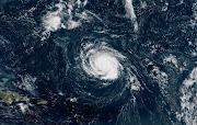 Hurricane Florence seen over the Atlantic Ocean, about 1,200 kilometres southeast of Bermuda, in this photo provided by the National Oceanic and Atmospheric Administration on September 9 2018.