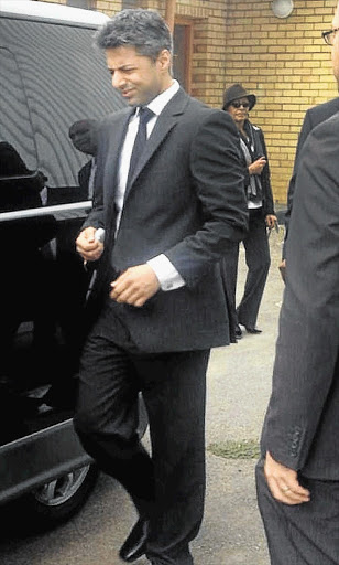 FIRST STEPS TO JUSTICE: Shrien Dewani arrives in Cape Town on Tuesday to make his first court appearance