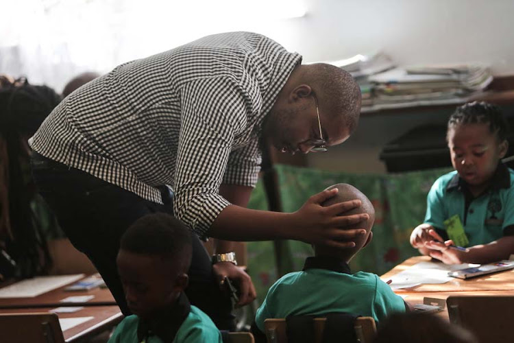 Itumeleng Lesele bids farewell to his son Mickyle Steyn on his first day of school at Melpark Primary school.