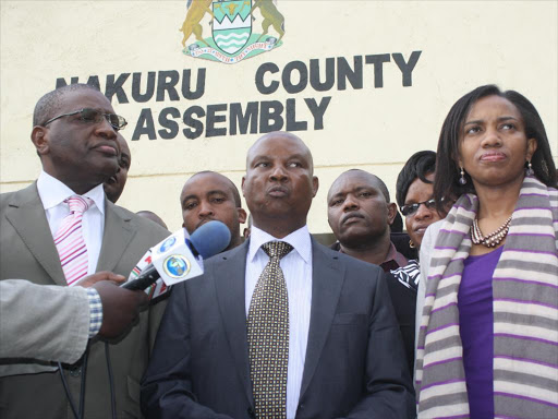 Nakuru County Senator James Mungai (left) Governor Kinuthia Mbugua (center) and Nakuru County Assembly Speaker Susan Kihika in a past press conference out side county assembly.