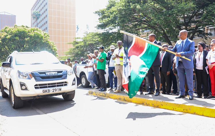 Lands CS Zachariah Njeru flags eight teams to audit land registries across the country in readiness for digitisation as PS Nixon Korir looks on October 2, 2023.