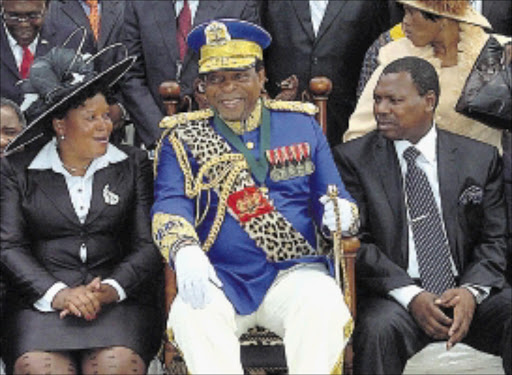 HIS MAJESTY: King Goodwill Zwelithini, centre, with Kwa Zulu - Natal premier Zweli Mkhize and KZN speaker Peggy Nkonyeni at the official opening of the KwaZulu - Natal legislature at the Royal Showgrounds in Pietermaritzburg yesterday. Pics: SIYABONGA MOSUNKUTU. Circa February 2010. © Sowetan