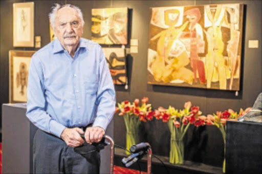 BIDDING FAREWELL: Harry Lits with paintings by Cecil Skotnes from his collection that will go under the hammer at the Wanderers Club in Johannesburg tomorrow