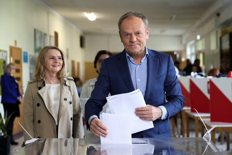 Polish Prime Minister Donald Tusk casts his vote next to his wife Malgorzata, during the Polish local elections at a polling station in Sopot, Poland, on April 7, 2024. Picture: REUTERS/LUKASZ GLOWALA