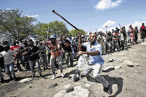 JOB HUNTERS: Protesters at Anglo Platinum's Jabulani Mine in Rustenburg, North West, demand to be reinstated yesterday, when the Marikana commission of inquiry considered police footage from the day in August that 34 miners were shot dead.