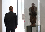 Director General of the Royal Museum for Central Africa (RMCA), Guido Gryseels, looks at a statue, dated to the 19th century, as Belgian government has announced plans to return pieces of art looted from Congo during colonial rule, in Tervuren, Belgium July 6, 2021.  