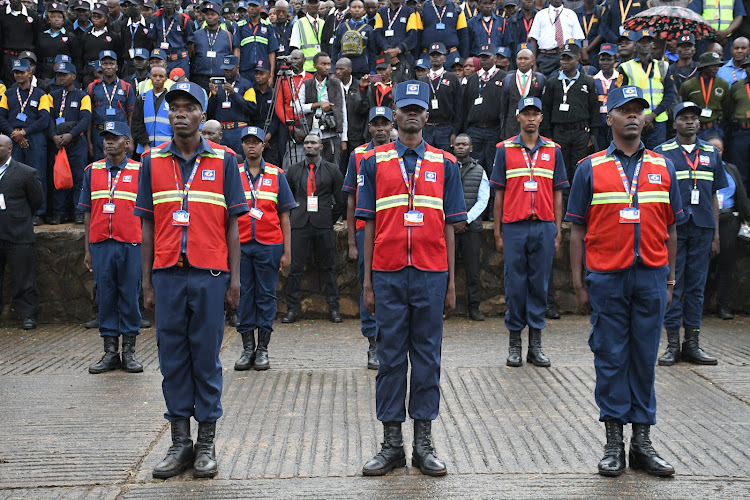 Private security guards mount a parade at Uhuru park during the mass registration exercise on March 30, 2024