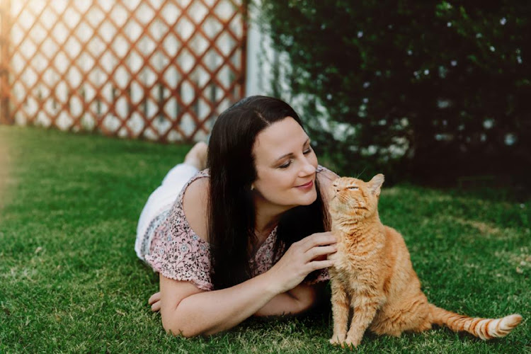 Debbie Kelly and her rescue baby Tiger, who was nursed back to health after being found beaten and burnt.