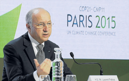 HARD AT WORK: French Foreign Affairs Minister Laurent Fabius, president-designate of COP21, attends a news conference during the World Climate Change Conference at Le Bourget, near Paris Picture: REUTERS