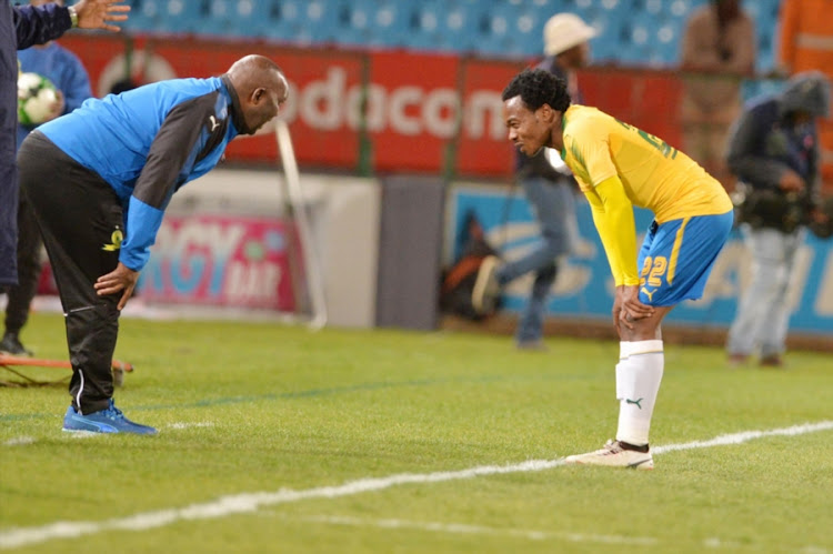 Mamelodi Sundowns head coach Pitso Mosimane chats to his star forward Percy Tau during the Absa Premiership match against Polokwane City at Loftus Versfeld Stadium on August 22, 2017 in Pretoria, South Africa.