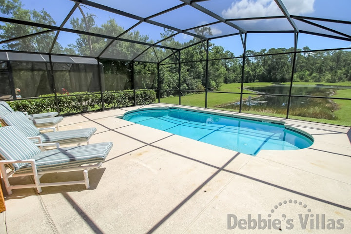 Kissimmee villa with a lake view from the private pool