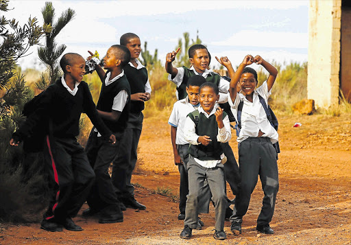 IN THE GROOVE: Schoolchildren cheer Absa Cape Epic riders as they pass through Villiersdorp yesterday
