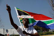 A protester outside the state capture inquiry in Johannesburg. 