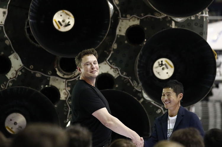 Elon Musk and Yusaku Maezawa at event at the SpaceX headquarters.