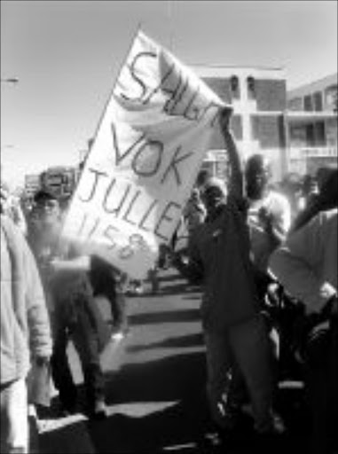 PAY UP: Municipal workers march in Cape Town.