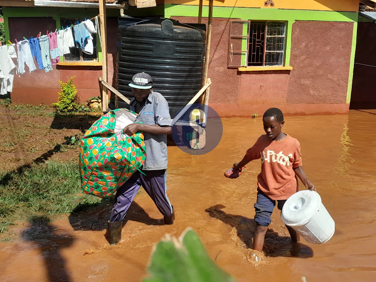 Residents vacating their flooded home in Mwea village, Gatundu North on May 7, 2024