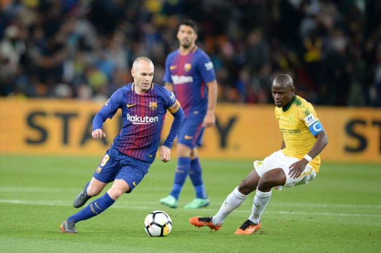 Andres Iniesta of Barcelona FC and Hlompho Kekana of Mamelodi Sundowns during the International Club Friendly match between Mamelodi Sundowns and Barcelona FC at FNB Stadium on May 16, 2018 in Johannesburg, South Africa.