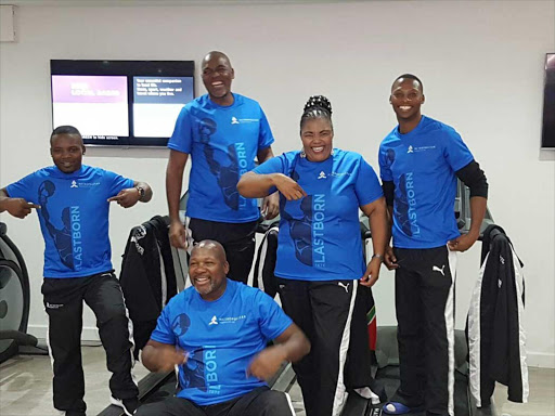 HOME AWAY FROM HOME: Zolani Tete, right, and his team were welcomed by sports MEC Pemmy Majodina, second from right, in Leicester, England where he will engage in a crucial world title eliminator against Arthur Villanueva on Saturday. Joining in the excitement are Makazole Tete, left, Mla Tengimfene (manager) and Loyisa Mtya (trainer seated) Picture: SUPPLIED
