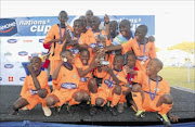 PACK YOUR BAGS: Daniye Primary School  celebrates after winning the 2013 Danone Under-12 national finals at WJ Clements Stadium in Reiger Park on Saturday 
      Photo: BackpagePix