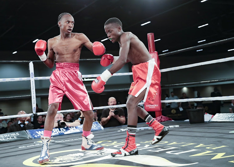 October 21, 2018. Ricardo Malajika, left, pummels Nkululeko Mnisi.