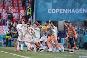 Spain players celebrate with their fans after the final whistle. 