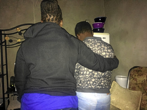 A 13-year-old rape victim is comforted by her mother at their KaNyamazane home in Mbombela, Mpumalanga. / Mandla Khoza