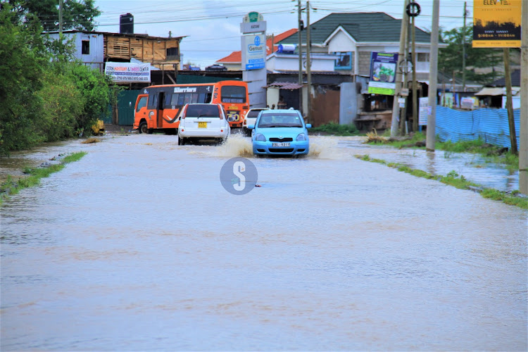 Vehicles stall along the flooded Syokimau - Katani road in Machakos County on Sunday, April 21, 2024.