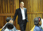 TV host Gareth Cliff waits at Johannesburg high court, prior to a hearing regarding the ruling against his layoff on January 29, 2015 in Johannesburg. AFP / STRINGER