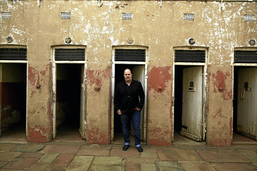 Clint Strydom in front of one of the cells that housed black inmates in No4 Prison.