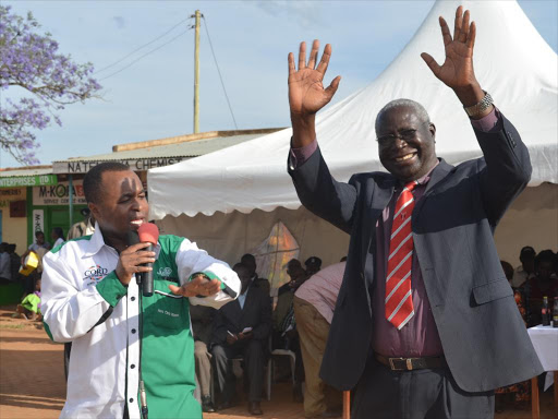 Kiminini MP Chris Wamalwa and Luhya council of elders chairman Patrick Wangamati at a past function. /FILE