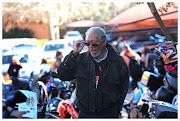 In this file photo, Hollywood Actor,  Morgan Freeman , adjusts his stylish glasses, in front of motorbikes, at The Nelson Mandela Foundation, in Houghton, JHB. Bikers were set to ride to Cape Town because of Nelson Mandela's birthday.