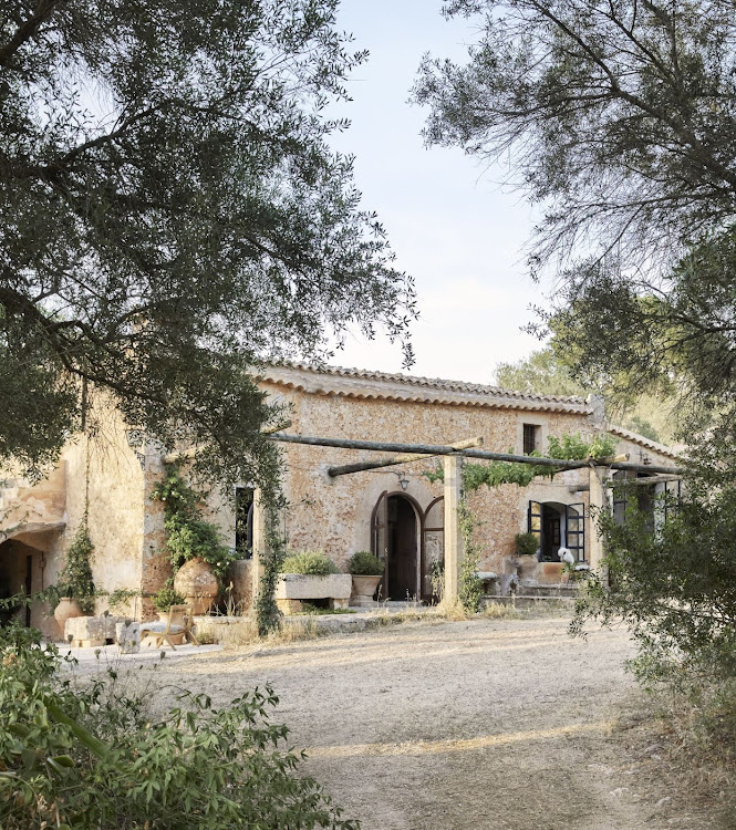 The house has simple architectural lines and a classic tiled roof.