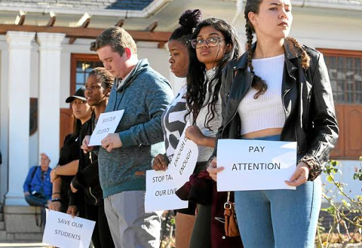 SHOCKED: Friends of murdered Hannah Cornelius and fellow Stellenbosch University students stage a silent protest outside the Stellenbosch Magistrate's Court yesterday