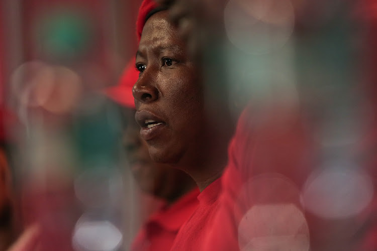 Leader of the EFF, Julius Malema talks to members of the media during a press conference at their offices in Braamfontein.