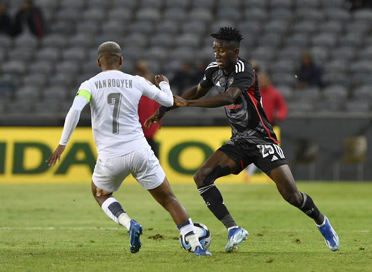 Deano van Rooyen of Stellenbosch fights for the ball with Karim Kimvuidi of Orlando Pirates during their DStv Premiership match at Orlando Stadium.