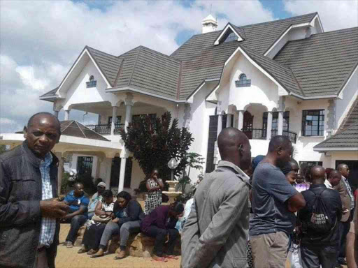 Mourners at the home of Thika businesswoman Joyce Wambui who was murdered on, February 27, 2017. /JOHN KAMAU