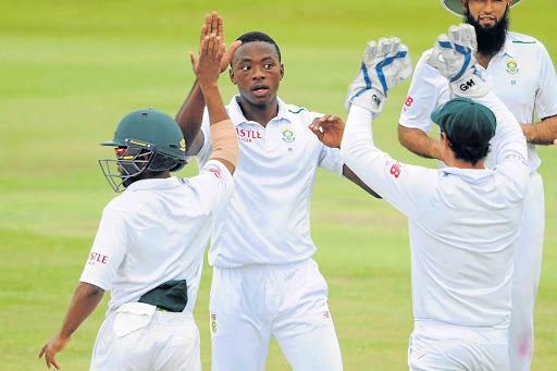 MASTERFUL DISPLAY: Kagiso Rabada celebrates the wicket of Alex Hales of England with fellow Proteas Temba Bavuma and Quinton de Kock during the Test match at SuperSport Stadium in Centurion. Rabada took a remarkable 13 scalps in the TestPicture: GALLO IMAGE
