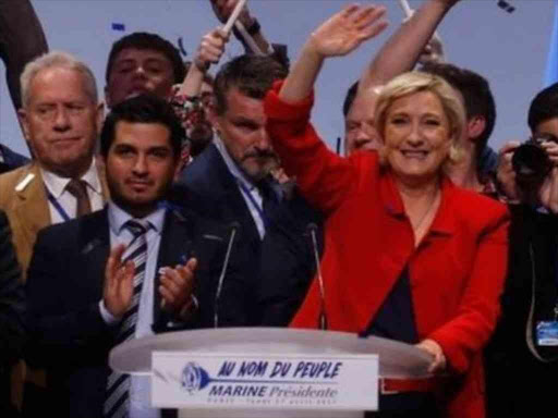 Marine Le Pen (centre) wants France to leave the EU. AGENCIES