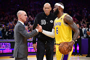 LA Lakers forward LeBron James meets with former player Kareem Abdul-Jabbar and NBA commissioner Adam Silver after breaking the NBA all time scoring record against the Oklahoma City Thunder during the second half at Crypto.com Arena in Los Angeles, California on February 7 2023.